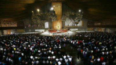 Members of a caravan of Central American mothers attend a mass at the Basilica of Guadalupe in Mexico City, Sunday, Oct. 28, 2012. The convoy, mostly comprised of women from Central America, travels through Mexico to search for their relatives who left for a better life and then disappeared on their journey to the U.S. About 100 have been reunited through similar trips through Mexico over six years. (AP Photo/Marco Ugarte)