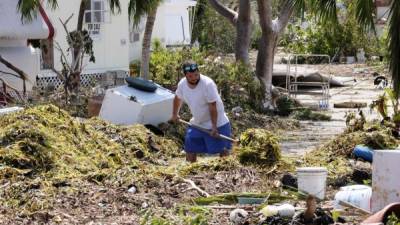 Alrededor de 11,2 millones de trabajadores viven en las áreas afectadas por los huracanes, lo que supone el 7,7 % de la fuerza laboral del país. / AFP PHOTO / Gaston De Cardenas