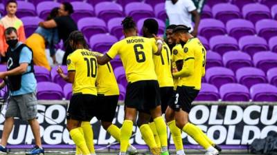 Jamaica's players celebrates after scoring a goal during the Gold Cup Prelims football match between Jamaica and Suriname at the Exploria Stadium in Orlando, Florida, on July 12, 2021. (Photo by CHANDAN KHANNA / AFP)