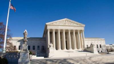 Wide View of the United States Supreme Court with American Flag - Washington DC