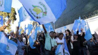 People protest against the United Nations International Commission Against Impunity, CICIG, in Guatemala City on January 8,2019. - Guatemalan President Jimmy Morales announced an immediate end to the UN-sponsored anti-corruption commission, CICIG, on January 7. (Photo by NOÉ PÉREZ / AFP)