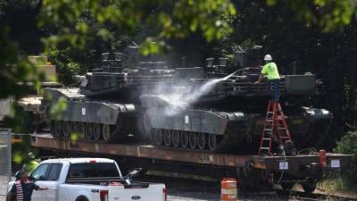 WASHINGTON, DC - JULY 02: A worker washes one of two M1A1 Abrams tanks that are loaded on rail cars at a rail yard on July 2, 2019 in Washington, DC. President Trump asked the Pentagon for military hardware, including tanks, to be displayed during Thursdays July 4th Salute to America celebration at the Lincoln Memorial. Mark Wilson/Getty Images/AFP