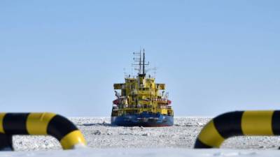 A picture taken on April 16, 2015 shows the icebreaker Tor at the port of Sabetta in the Kara Sea shore line on the Yamal Peninsula in the Arctic circle, some 2450 km of Moscow. The Yamal LNG (liquefied natural gas) project aiming to extract and liquefy gas from the Yuzhno-Tambeyskoye gas field is scheduled to start production in 2017. Russia's Novatek holds a 60 percent stake in the venture. France's Total and China's CNPC hold 20 percent each. AFP PHOTO / KIRILL KUDRYAVTSEV (Photo credit should read KIRILL KUDRYAVTSEV/AFP/Getty Images)