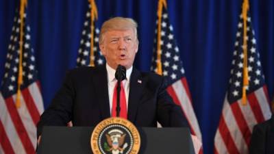 US President Donald Trump speaks to the press about protests in Charlottesville on August 12, 2017, at Trump National Golf Club in Bedminster, New Jersey.A picturesque Virginia city braced Saturday for a flood of white nationalist demonstrators as well as counter-protesters, declaring a local emergency as law enforcement attempted to quell early violent clashes. / AFP PHOTO / JIM WATSON