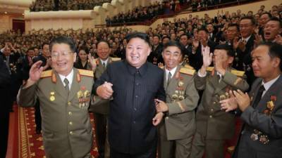 North Korean leader Kim Jong-un (2nd from L) holding hands with other ranking officials at a banquet in celebration of its latest nuclear test conducted, Pyongyang, North Korea, 03 September 2017 (Issued 10 September 2017). EFE