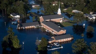 CONWAY, SC - SEPTEMBER 17: A church is surrounded by floodwaters from Hurricane Florence on September 17, 2018, in Conway, South Carolina. Many rivers in the Carolinas are approaching record flood stages and their levels will continue to rise through the week. Sean Rayford/Getty Images/AFP