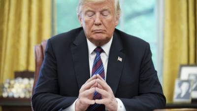 (FILES) In this file photo taken on August 27, 2018, US President Donald Trump listens during a phone conversation with Mexico's President Enrique Pena Nieto on trade, in the Oval Office of the White House in Washington, DC. - Firing the US election security chief and pressuring local officials to throw out valid votes, President Donald Trump and his Republicans are making desperate -- though likely futile -- attempts to invalidate Democrat Joe Biden's election win. Trump showed no sign on November 18, 2020 of letting up on his campaign to challenge results of the November 3 vote that only he and his staunchest supporters refuse to accept. Two weeks after Election Day -- with Biden's win recognized around the world, and his team hard at work preparing to assume office -- Trump appears convinced he can sow enough doubt to delay or even prevent the Democrat from being officially certified as the winner. (Photo by MANDEL NGAN / AFP)