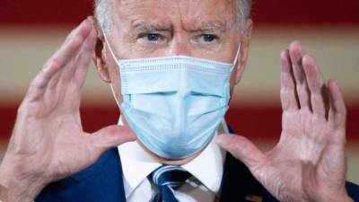 (FILES) In this file photo former Democratic presidential candidate Joe Biden speaks during a campaign event in Fort Lauderdale, Florida on October 13, 2020. - US President-elect Joe Biden on November 9, 2020 named the scientists who will lead his administration's response to the coronavirus pandemic, signaling his plans to prioritize Covid-19 from the outset. The advisory board will be led by three co-chairs: epidemiologist and former Federal Drug Administration (FDA) commissioner David Kessler, former surgeon general Vivek Murthy, and Yale public health professor Marcella Nunez-Smith, according to a statement from the Biden transition team. (Photo by JIM WATSON / AFP)