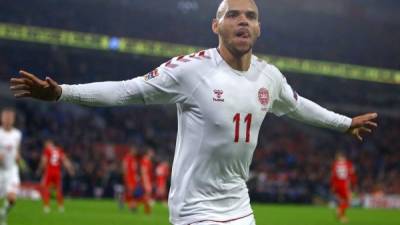 (FILES) In this file photo taken on November 16, 2018 Denmark's striker Martin Braithwaite celebrates after scoring their second goal during the UEFA Nations League Group B football match between Wales and Denmark at Cardiff City Stadium in Cardiff on November 16, 2018. - FC Barcelona have recruited Denmark's striker Martin Braithwaite, who played for Leganes, the Catalan club announced on February 20, 2020. (Photo by Geoff CADDICK / AFP)
