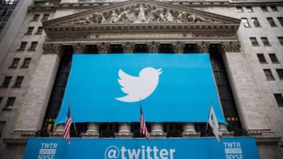 (FILES) This file photo taken on November 6, 2013 shows the Twitter logo displayed on a banner outside the New York Stock Exchange (NYSE) in New York.Twitter shares soared more than 16 percent September 23, 2016 after CNBC reported that the company was moving close to a sale, with Alphabet/Google and Salesforce possible buyers. Talk has been circulating for weeks that the popular messaging platform was opening its doors to potential buyers.CNBC cited unnamed sources in the report, adding that it is still early in the process. / AFP PHOTO / GETTY IMAGES NORTH AMERICA / Andrew Burton