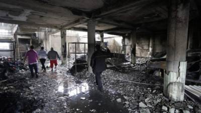 View inside a house burnt down under unclear circumstances and in which four adults and two children died, in the Carlos Marx neighborhood, in Managua on June 16, 2018. / AFP PHOTO / INTI OCON