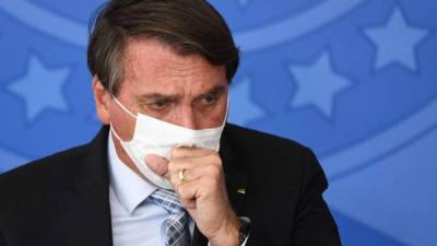 Bolsonaro ha sido duramente criticado por su manejo de la pandemia en pleno repunte del coronavirus que ha roto récords de contagios y muertes y tras el surgimiento de una nueva variante que amenaza al mundo./AFP.