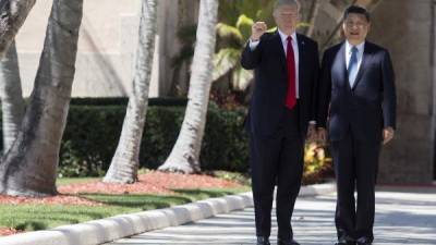 El presidente Trump junto a su homólogo chino, Xi Jinping. AFP.