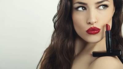 beautiful woman portrait with red lipstick on her shoulder, studio shot