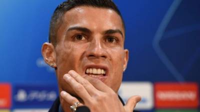 Juventus' Portuguese striker Cristiano Ronaldo gestures during a press conference at Old Trafford in Manchester, north west England on October 22, 2018, ahead of their UEFA Champions League group H football match against Juventus on October 23. (Photo by Oli SCARFF / AFP)