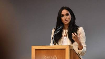 (FILES) In this file photo taken on March 06, 2020 Britain's Meghan, Duchess of Sussex speaks during a school assembly as part of a visit to Robert Clack School in Essex, on March 6, 2020, in support of International Womens Day. - Meghan Markle has revealed she suffered a miscarriage in July this year, writing in the New York Times on November 25, 2020 of the deep grief and loss she endured with her husband Prince Harry. (Photo by BEN STANSALL / POOL / AFP) / == STRICTLY EMBARGOED == NO USE AND NO PUBICATION ON ANY PLATFORM UNTIL 22:30 GMT MARCH 7, 2020 ==