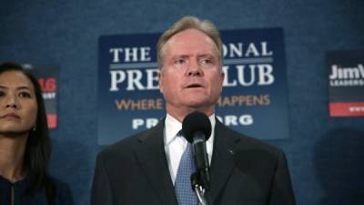 WASHINGTON, DC - OCTOBER 20: Former U.S. Sen. Jim Webb (D-VA) speaks as his wife Hong Le Webb listens during a news conference at the National Press Club October 20, 2015 in Washington, DC. Sen. Webb announced that he is dropping out of the Democratic presidential race. Alex Wong/Getty Images/AFP== FOR NEWSPAPERS, INTERNET, TELCOS & TELEVISION USE ONLY ==