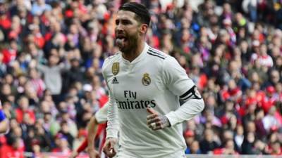 Real Madrid's Spanish defender Sergio Ramos celebrates after scoring a penalty during the Spanish league football match between Club Atletico de Madrid and Real Madrid CF at the Wanda Metropolitano stadium in Madrid on February 9, 2019. (Photo by GABRIEL BOUYS / AFP)