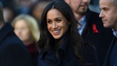 (FILES) In this file photo taken on May 22, 2018 Britain's Meghan, Duchess of Sussex, attends the Prince of Wales's 70th Birthday Garden Party at Buckingham Palace in London. - A London court on March 5, 2021, ordered Britain's Mail on Sunday newspaper to publish a front-page statement after Meghan won a breach of privacy and copyright claim against it. Since moving to North America with their young son, Archie, they have launched a series of legal action against media organisations for their reporting. (Photo by Dominic Lipinski / POOL / AFP)