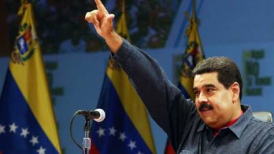 Maduro dice que está loco por ser leal a Hugo Chávez. AFP