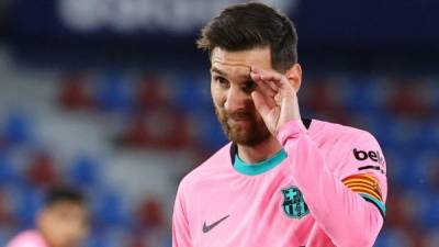 Barcelona's Argentinian forward Lionel Messi looks on during the Spanish league football match Levante UD against FC Barcelona at the Ciutat de Valencia stadium in Valencia on May 11, 2021. (Photo by JOSE JORDAN / AFP)