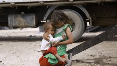 Los niños corren el riesgo de un reclutamiento forzado para los combates. AFP