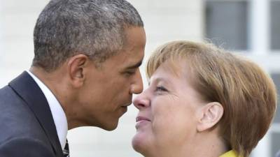 Obama junto a la canciller Angela Merkel. Foto: AFP/John MacDougall