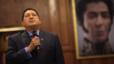 FILE - In this Oct. 9, 2012 file photo, Venezuela's President Hugo Chavez pauses during a press conference in front of a portrait of independence hero Simon Bolivar, at the Miraflores palace in Caracas, Venezuela. Chavez has asked his country's legislature for permission to travel to Cuba for more medical treatment after spending much of the past 18 months fighting cancer. (AP Photo/Rodrigo Abd, File)