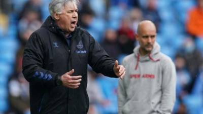 Everton's Italian head coach Carlo Ancelotti (L) reacts during the English Premier League football match between Manchester City and Everton at the Etihad Stadium in Manchester, north west England, on May 23, 2021. (Photo by Dave Thompson / POOL / AFP) / RESTRICTED TO EDITORIAL USE. No use with unauthorized audio, video, data, fixture lists, club/league logos or 'live' services. Online in-match use limited to 120 images. An additional 40 images may be used in extra time. No video emulation. Social media in-match use limited to 120 images. An additional 40 images may be used in extra time. No use in betting publications, games or single club/league/player publications. /