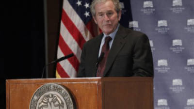 Former President George W. Bush gives opening remarks at the Federal Reserve Bank of Dallas for a conference titled 'Immigration and 4% Growth: How Immigrants grow the U.S. Economy,' Tuesday, Dec. 4, 2012, in Dallas. The George W. Bush Institute is hosting panel discussions highlighting the positive impact of immigration on U.S. economic growth. (AP Photo/LM Otero)