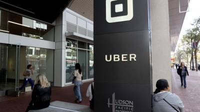 (FILES) This file photo taken on August 25, 2016 shows the logo of the ride sharing service Uber in front of its headquarters in San Francisco, California. Uber has parted ways with another top executive, in the latest dent to the reputation of the ridesharing giant as it prepares to release the results of a probe into workplace misconduct. The executive, Eric Alexander, read and discussed medical information about a woman raped in India in 2014 during an Uber ride, according to reports in the New York Times and Recode.An Uber spokeswoman told AFP on June 8, 2017 that Alexander is 'no longer with the company,' but declined to comment on the reasons for his departure or on the reports on his handling of the India rape case. / AFP PHOTO / GETTY IMAGES NORTH AMERICA / JUSTIN SULLIVAN