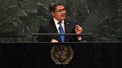 President of Honduras Juan Orlando Hernandez Alvarado speaks at the 74th Session of the General Assembly at the United Nations headquarters on September 25, 2019 in New York. (Photo by TIMOTHY A. CLARY / AFP)