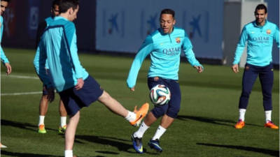 Los jugadores del Barcelona en el entrenamiento de este viernes.