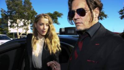 El actor Johnny Depp con Amber Heard.