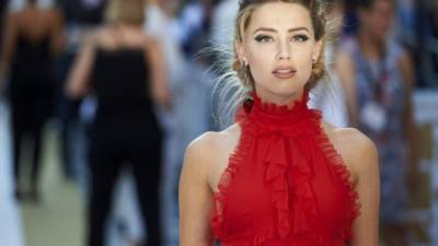 (FILES) In this file photo taken on July 22, 2020 US actress Amber Heard arrives to give evidence at the libel trial by her former husband US actor Johnny Depp against News Group Newspapers (NGN), at the High Court in London, on July 22, 2020. - Hollywood star Johnny Depp on November 2, 2020 lost his libel lawsuit against British newspaper The Sun for branding him a 'wife-beater' in a case that laid bare his chaotic lifestyle. Judge Andrew Nicol dismissed the 57-year-old's claim saying the newspaper group's article had been proven to be 'substantially true', adding 'the claimant has not succeeded in his action for libel'. (Photo by Niklas HALLE'N / AFP)