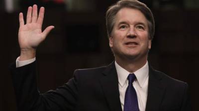 (FILES) In this file photo taken on September 05, 2018, US Supreme Court nominee Brett Kavanaugh speaks on the second day of his confirmation hearing in front of the US Senate on Capitol Hill in Washington DC,The US Senate confirmed President Donald Trump's Supreme Court pick Brett Kavanaugh on Saturday, October 6, 2018 in the closest such vote in more than a century, amid controversy over sexual abuse allegations against him. The Senate voted 50-48 to approve Kavanaugh in a major win for Trump as more than 1,000 protesters rallied in Washington against a nominee who had to overcome questions over his candor, partisan rhetoric and lifestyle as a young man. / AFP PHOTO / SAUL LOEB