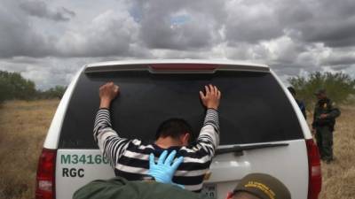 ROMA, TX - AUGUST 16: Detained immigrants are searched after being captured by U.S. Border Patrol agents on August 16, 2016 in Roma, Texas. Border security has become a main issue in the U.S. Presidential campaign, as Republican Presidential candidate Donald Trump has promised to build a wall, at Mexico's expense to fortify the U.S.-Mexico border. John Moore/Getty Images/AFP== FOR NEWSPAPERS, INTERNET, TELCOS & TELEVISION USE ONLY ==