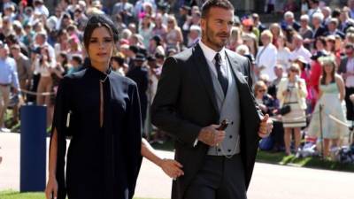 Victoria y David Beckham a su llegada a la capilla San Jorge para la boda real el pasado 19 de mayo. Foto archivo AFP.