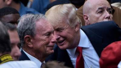 (FILES) In this file photo taken on September 11, 2016 US Republican presidential nominee Donald Trump speaks to former New York City Mayor Michael Bloomberg during a memorial service at the National 9/11 Memorial in New York. - President Donald Trump's campaign said on December 2, 2019 it was banning journalists from Bloomberg News from its electoral events, claiming 'bias' by the media group owned by presidential rival Michael Bloomberg.Brad Parscale, the Trump 2020 campaign manager, said the decision was made after Bloomberg News announced it would not investigate the company boss or his Democrat competitors. (Photo by Brendan SMIALOWSKI / AFP)