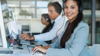 Portrait of a happy and confident young woman working in a call center