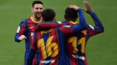 Dembélé y Lionel Messi fueron los encargados de anotar en el triunfo del Barcelona en campo del Sevilla. Foto AFP.