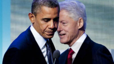 President Barack Obama steps to the microphone after being introduced by former President Bill Clinton, Tuesday, Sept. 25, 2012, at the Clinton Global Initiative in New York. (AP Photo/Mark Lennihan)