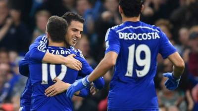 Desde la izquierda, los jugadores de Chelsea Antonio Rüdiger, Kurt Zouma y Fikayo Tomori celebran luego de una victoria de 2-0 sobre Tottenham en la Liga Premier en Londres el domingo, 22 de diciembre del 2019. (AP Foto/Ian Walton)