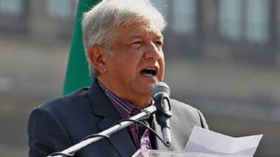 Handout picture released by Mexico's Presidency showing Mexican President Andres Manuel Lopez Obrador gesturing during a press conference at the National Palace in Mexico City, on March 24, 2020 during the new coronavirus, COVID-19, pandemic. (Photo by - / Mexican Presidency / AFP) / RESTRICTED TO EDITORIAL USE - MANDATORY CREDIT 'AFP PHOTO / MEXICO'S PRESIDENCY' - NO MARKETING - NO ADVERTISING CAMPAIGNS - DISTRIBUTED AS A SERVICE TO CLIENTS