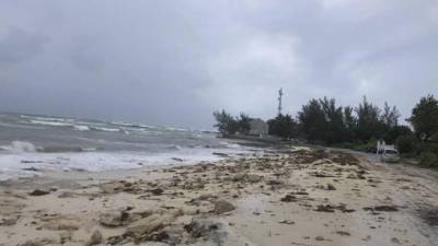 Ocean waves are seen on the beach during the approach of Hurricane Dorian on September 1, 2019 in Nassau, Bahamas. - Hurricane Dorian strengthened into a catastrophic Category 5 storm Sunday, packing 160 mph (267 kph) winds as it was about to slam into the Abaco Islands in the Bahamas, US weather forecasters said.'#Dorian is now a category 5 #hurricane with 160 mph sustained winds,' the Miami-based National Hurricane Center said in a tweet. 'The eyewall of this catastrophic hurricane is about to hit the Abaco Islands with devastating winds,' it said.The slow moving storm was expected to linger over the Bahamas through Sunday and much of Monday, dumping up to 25 inches of rain in some areas and unleashing storm surges of 10 to 15-feet, forecasters said. (Photo by Lucy WORBOYS / AFP)