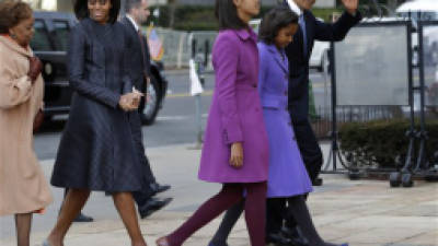 President Barack Obama, waves as he walks with his daughters Sasha and Malia, first lady Michelle Obama and mother-in-law Marian Robinson, to St. John's Church in Washington, Monday, Jan. 21, 2013, for a church service during the 57th Presidential Inauguration. (AP Photo/Jacquelyn Martin)