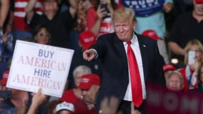 MESA, AZ - OCTOBER 19: President Donald Trump points to a supporter during a rally at the International Air Response facility on October 19, 2018 in Mesa, Arizona. President Trump is holding rallies in Arizona, Montana and Nevada, campaigning for Republican candidates running for the U.S. Senate. Ralph Freso/Getty Images/AFP