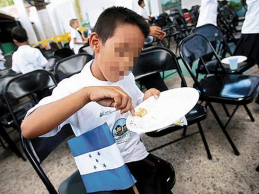 Merienda escolar en Honduras. Foto de archivo.