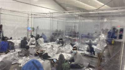 TOPSHOT - A handout photograph courtesy of the Office of Congressman Henry Cuellar (TX-28), released on march 22, 2021, shows migrants inside of a US Customs and Border Protection temporary overflow facility in Donna, Texas. - The Customs and Border Protection facility in Donna, near the southern tip of Texas, opened on February 2021 to handle the increases of illegal immigration, and particularly children, at the US-Mexico border. (Photo by Handout / Office of Congressman Henry Cuellar (TX-28) / AFP) / RESTRICTED TO EDITORIAL USE - MANDATORY CREDIT 'AFP PHOTO /Office of Congressman Henry Cuellar (TX-28) ' - NO MARKETING - NO ADVERTISING CAMPAIGNS - DISTRIBUTED AS A SERVICE TO CLIENTS