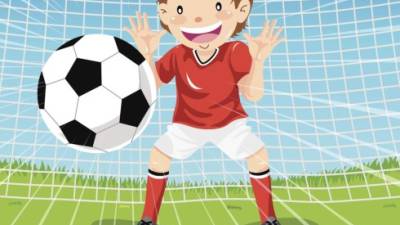 Teenage boy Goalie catching soccer ball.